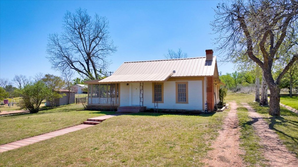 205 East Rainey Street Mason, TX 76856 - Photo 36 of 37 a view of a house with a yard covered with snow in front of it