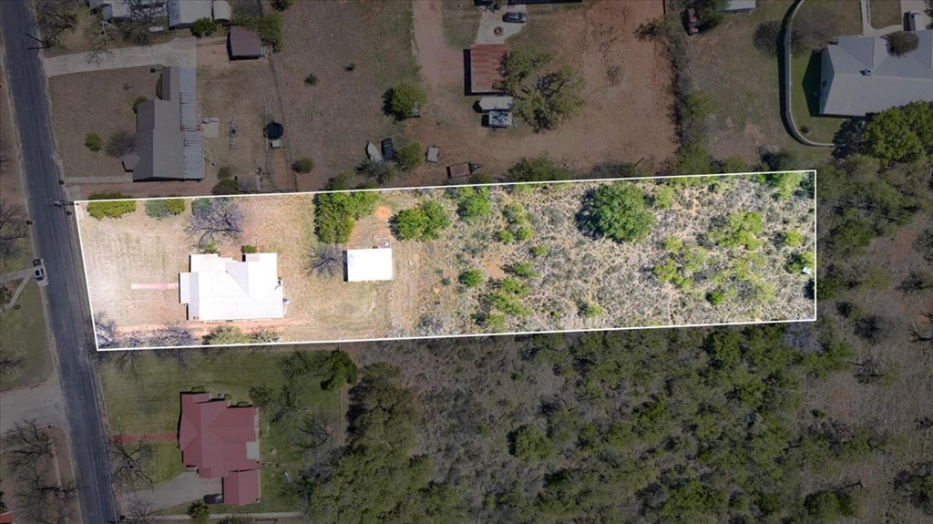 205 East Rainey Street Mason, TX 76856 - Photo 37 of 37 an aerial view of a house with a yard and a wooden fence