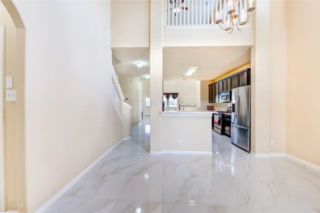 a view of a kitchen and utility room