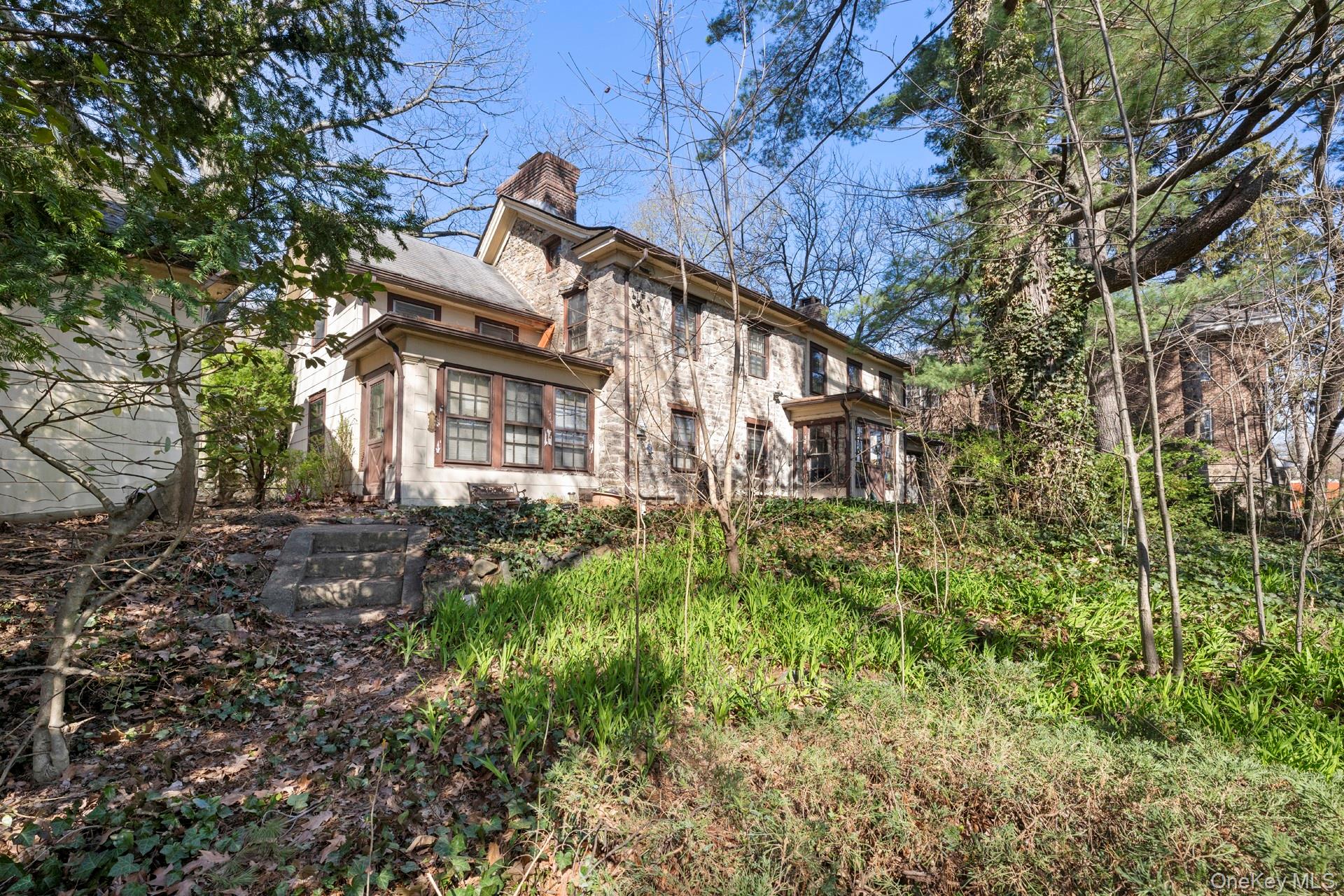5122 Post Road Bronx, NY 10471 - Photo 7 of 11 a brick building with green field in front of it