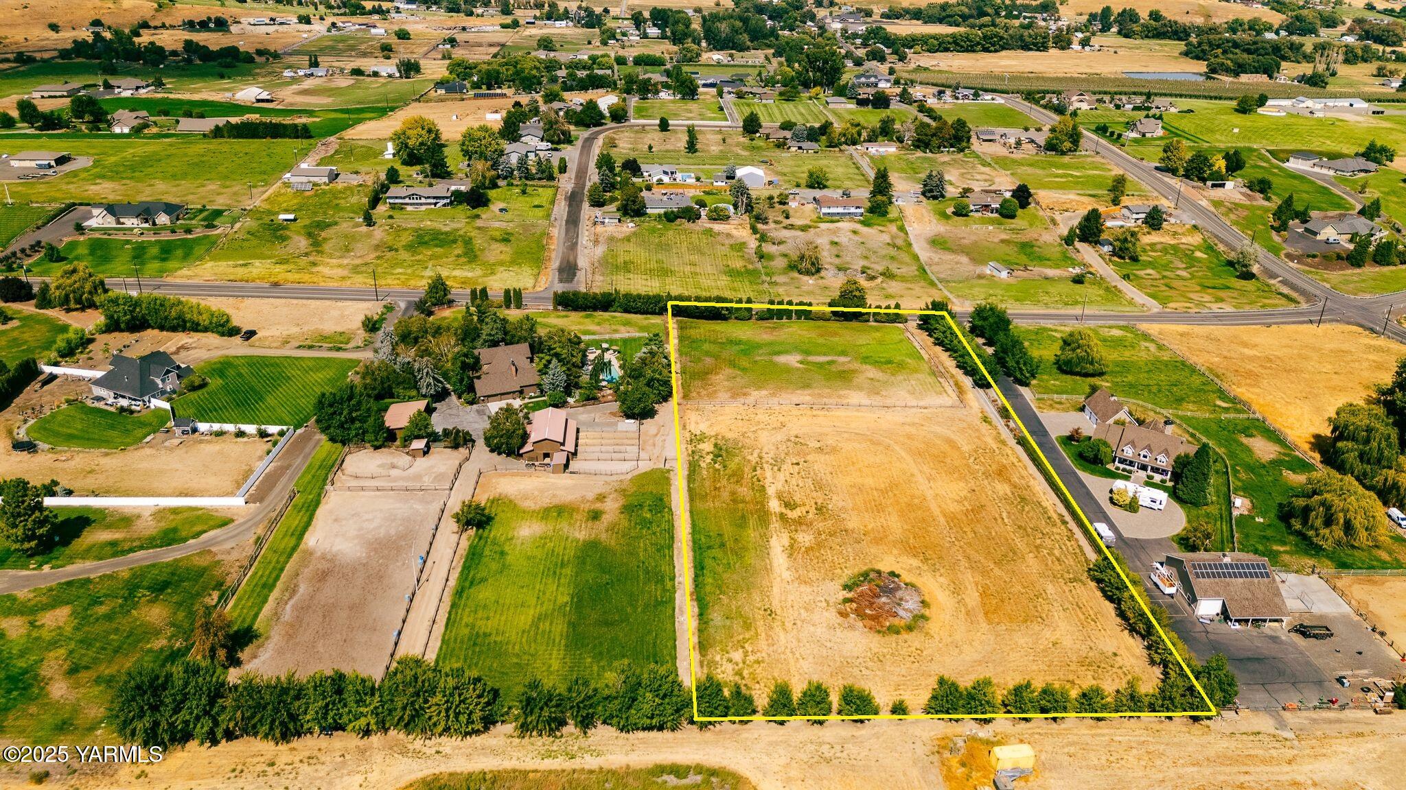 an aerial view of residential houses with swimming pool