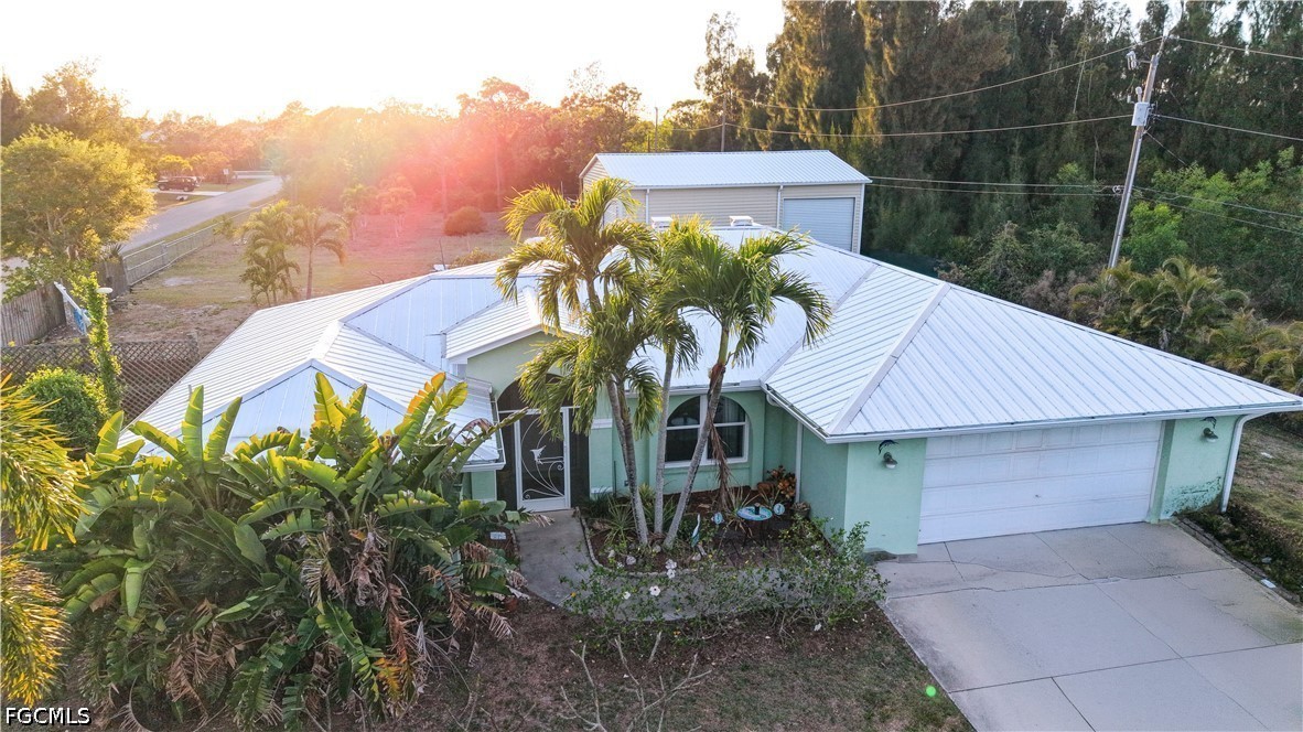 a view of a house with a yard and plants