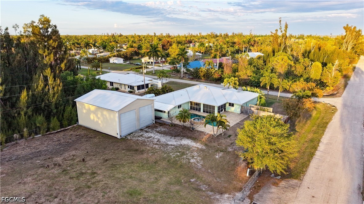 12341 Marlin Road Bokeelia, FL 33922 - Photo 2 of 26 a view of a house with a yard and sitting area
