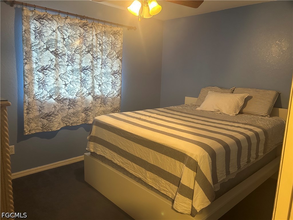 12341 Marlin Road Bokeelia, FL 33922 - Photo 22 of 26 a bedroom with a bed and a window