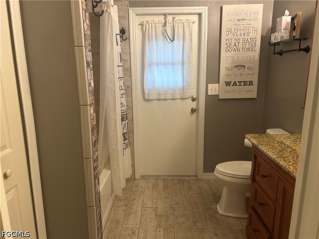 12341 Marlin Road Bokeelia, FL 33922 - Photo 24 of 26 a bathroom with a toilet and a shower
