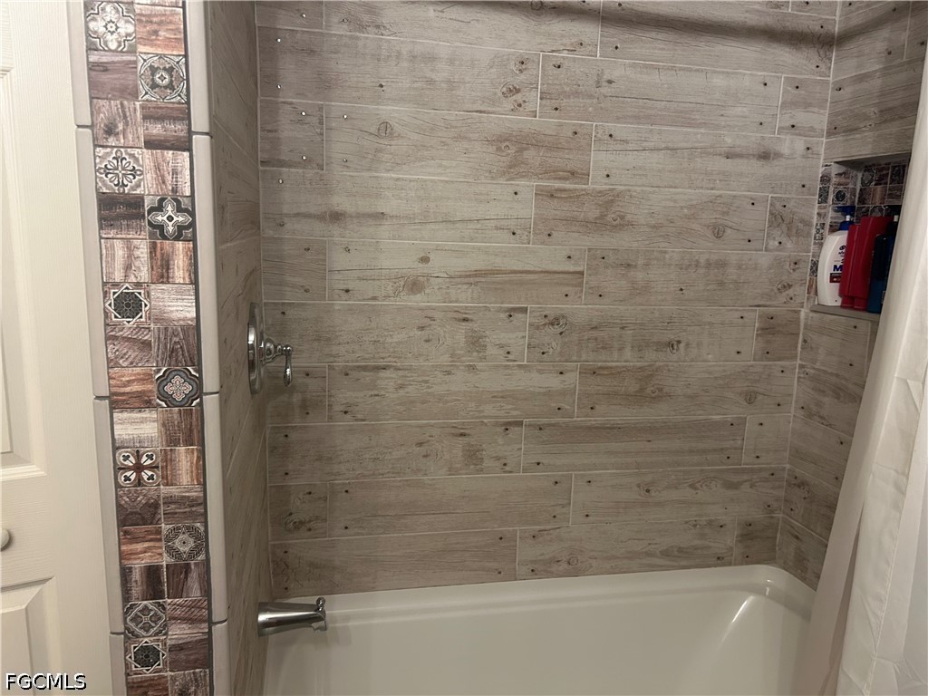 12341 Marlin Road Bokeelia, FL 33922 - Photo 25 of 26 a bathroom with a bathtub