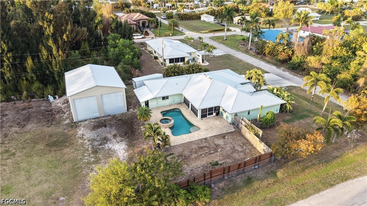 12341 Marlin Road Bokeelia, FL 33922 - Photo 3 of 26 an aerial view of a house with a yard and trees