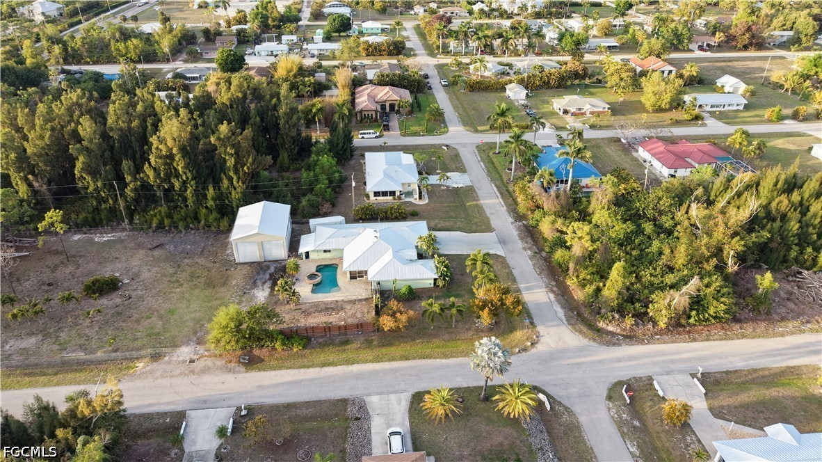 12341 Marlin Road Bokeelia, FL 33922 - Photo 4 of 26 an aerial view of a house with swimming pool