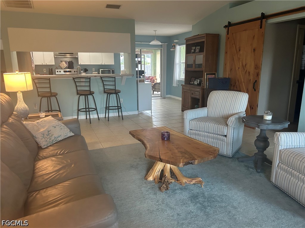 12341 Marlin Road Bokeelia, FL 33922 - Photo 7 of 26 a living room with furniture and wooden floor
