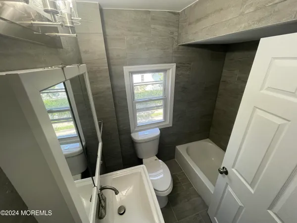 a bathroom with a sink and toilet