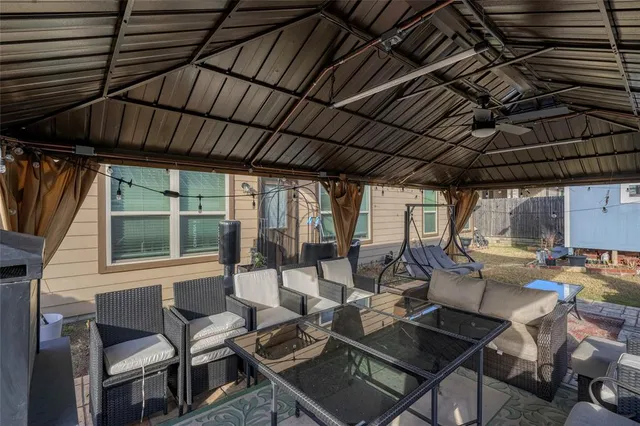 a view of a chairs and table in the patio