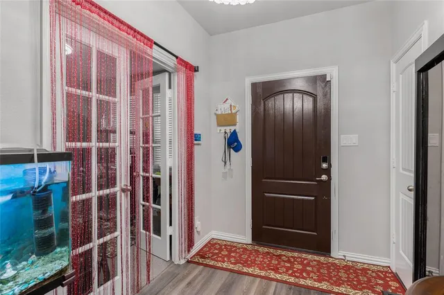 a view of entryway with wooden floor