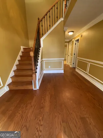 a view of entryway with wooden floor