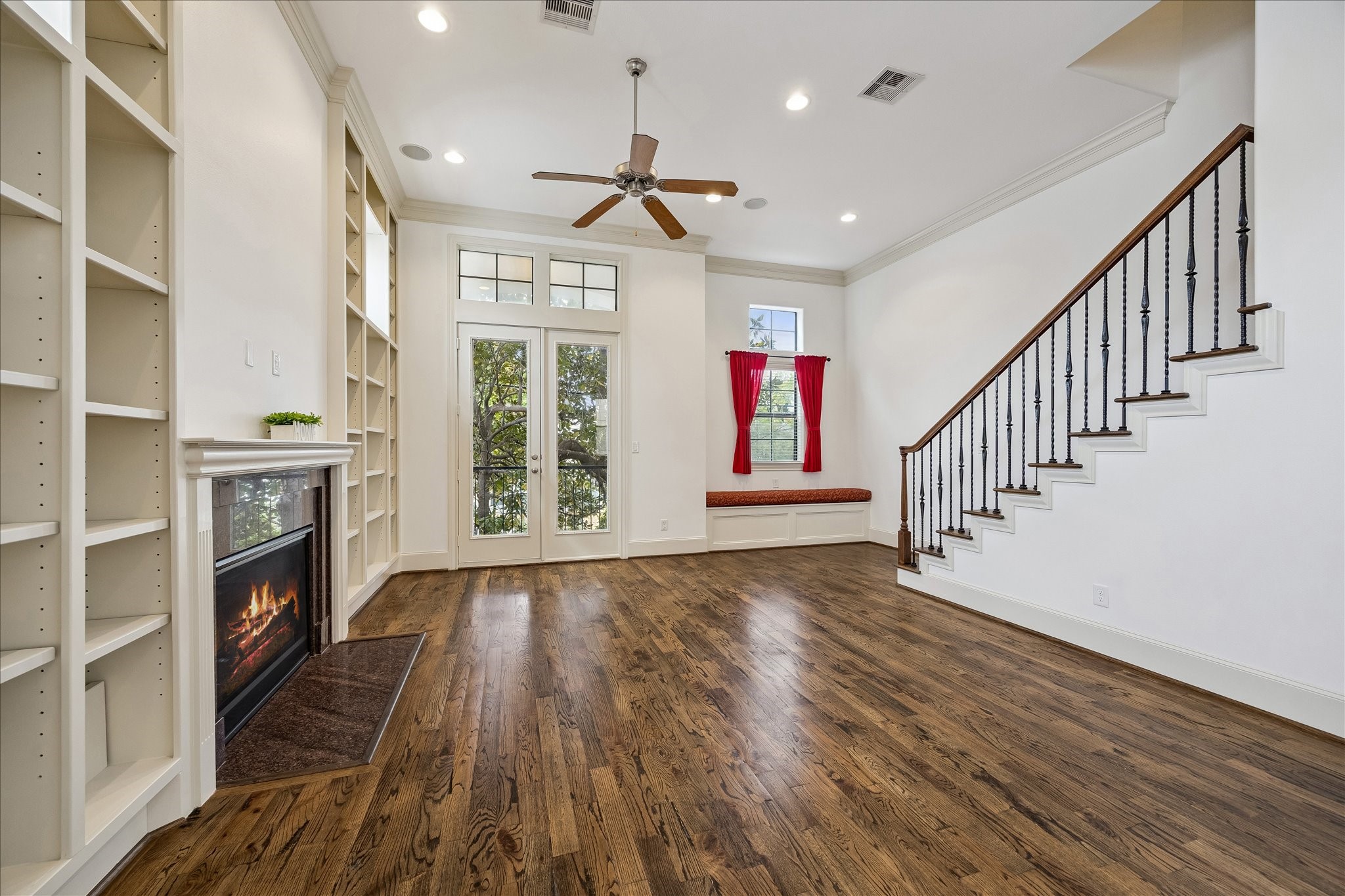 1407 Shearn Street Houston, TX 77007 - Photo 20 of 35 Living room features a covered balcony hidden by a huge magnolia tree.