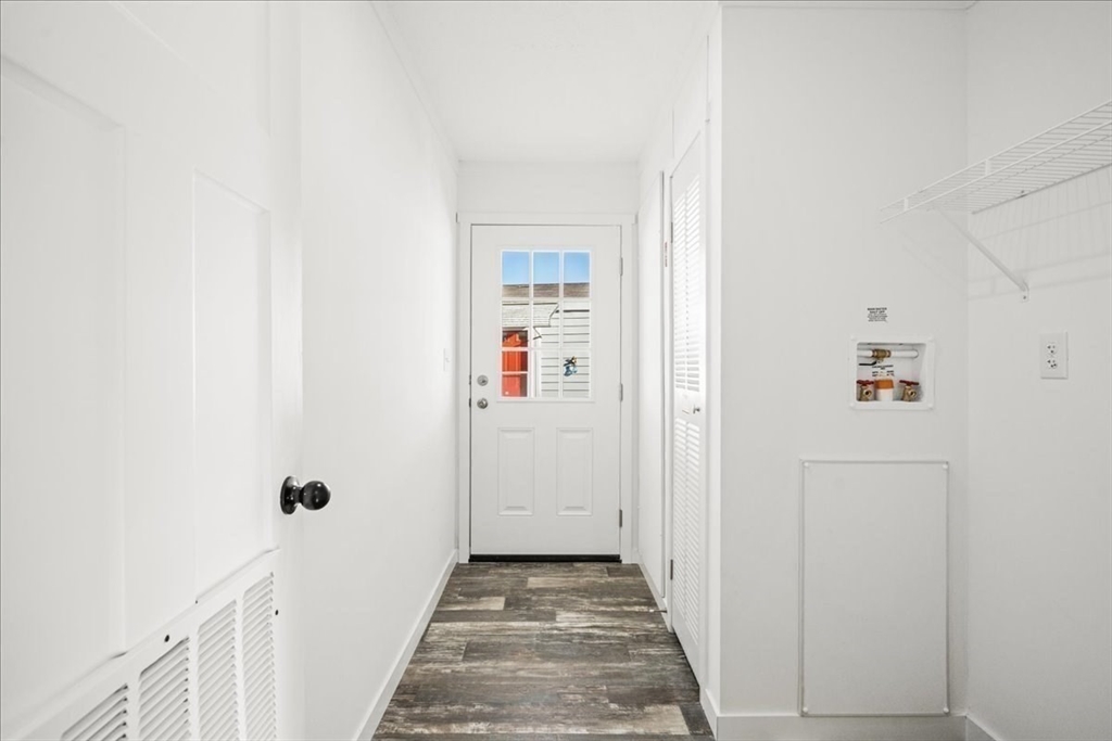 6 Berry Farms Road, Unit 64 Sturbridge, MA 01566 - Photo 18 of 18 a view of a hallway with wooden floor and entryway
