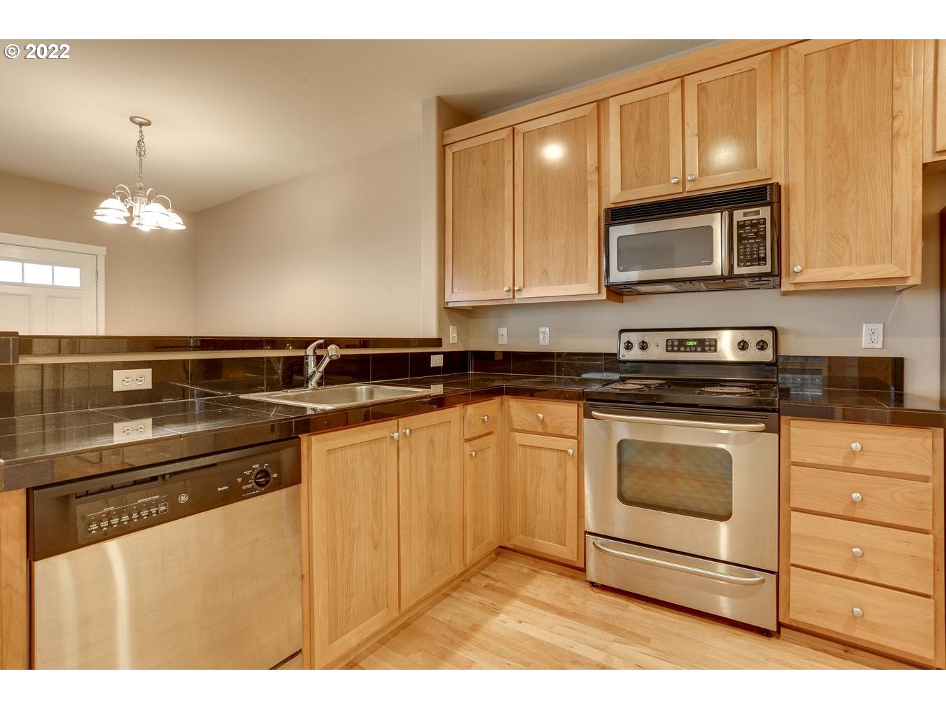 1020 Southwest 170th Avenue, Unit 100 Beaverton, OR 97003 - Photo 14 of 28 a kitchen with a sink and cabinets
