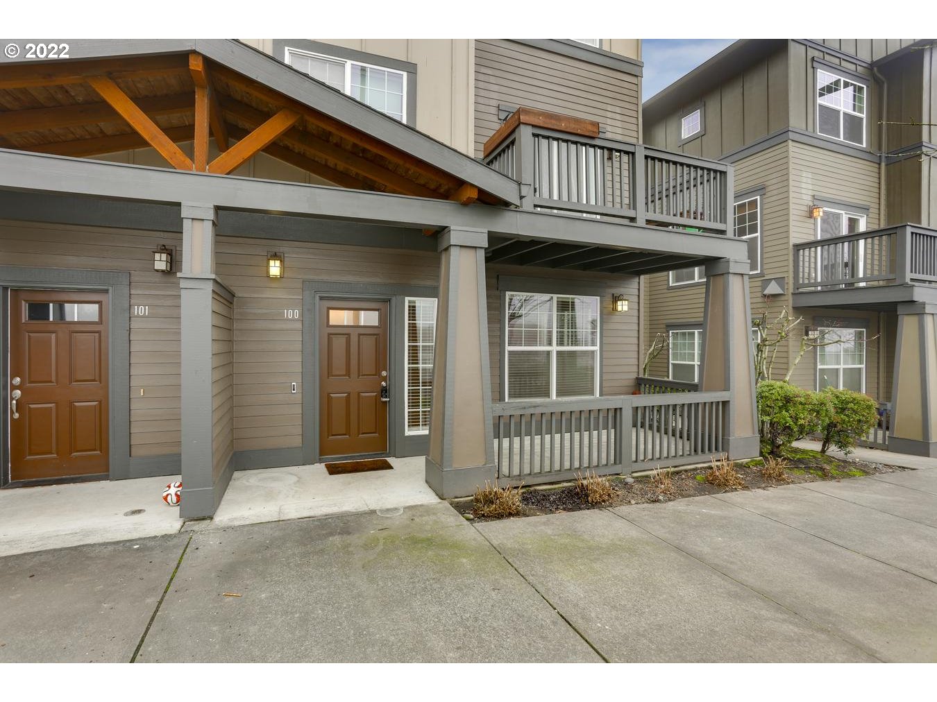 1020 Southwest 170th Avenue, Unit 100 Beaverton, OR 97003 - Photo 4 of 28 a view of a house with wooden fence