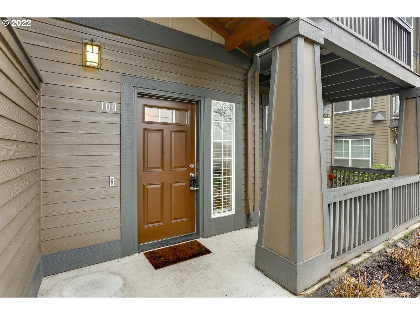 1020 Southwest 170th Avenue, Unit 100 Beaverton, OR 97003 - Photo 5 of 28 a view of a porch with a door and wooden floor
