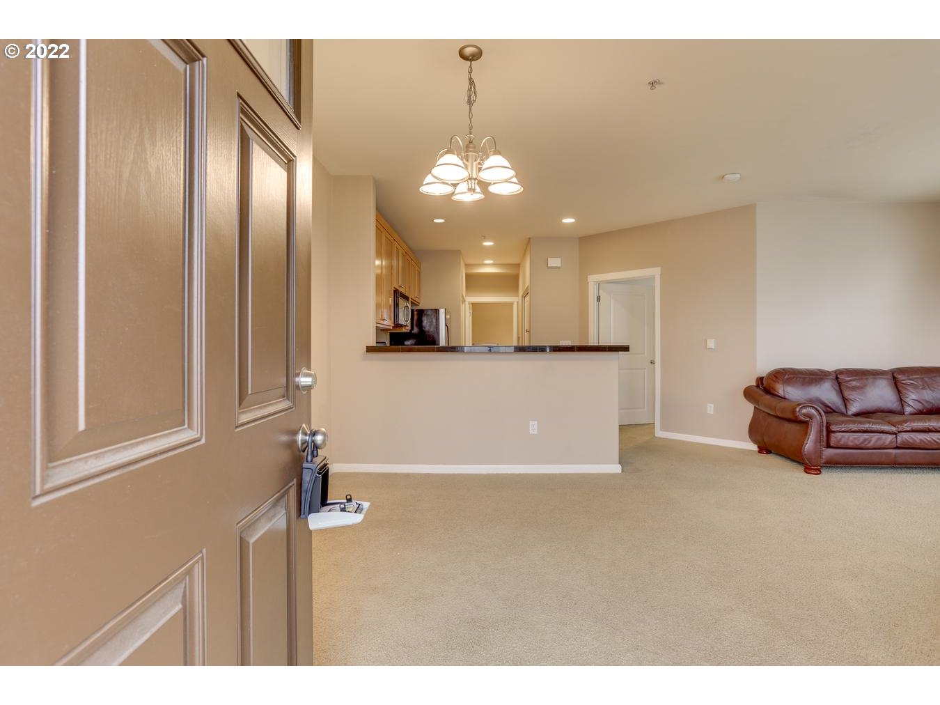 1020 Southwest 170th Avenue, Unit 100 Beaverton, OR 97003 - Photo 6 of 28 a view of a livingroom with a chandelier furniture and windows