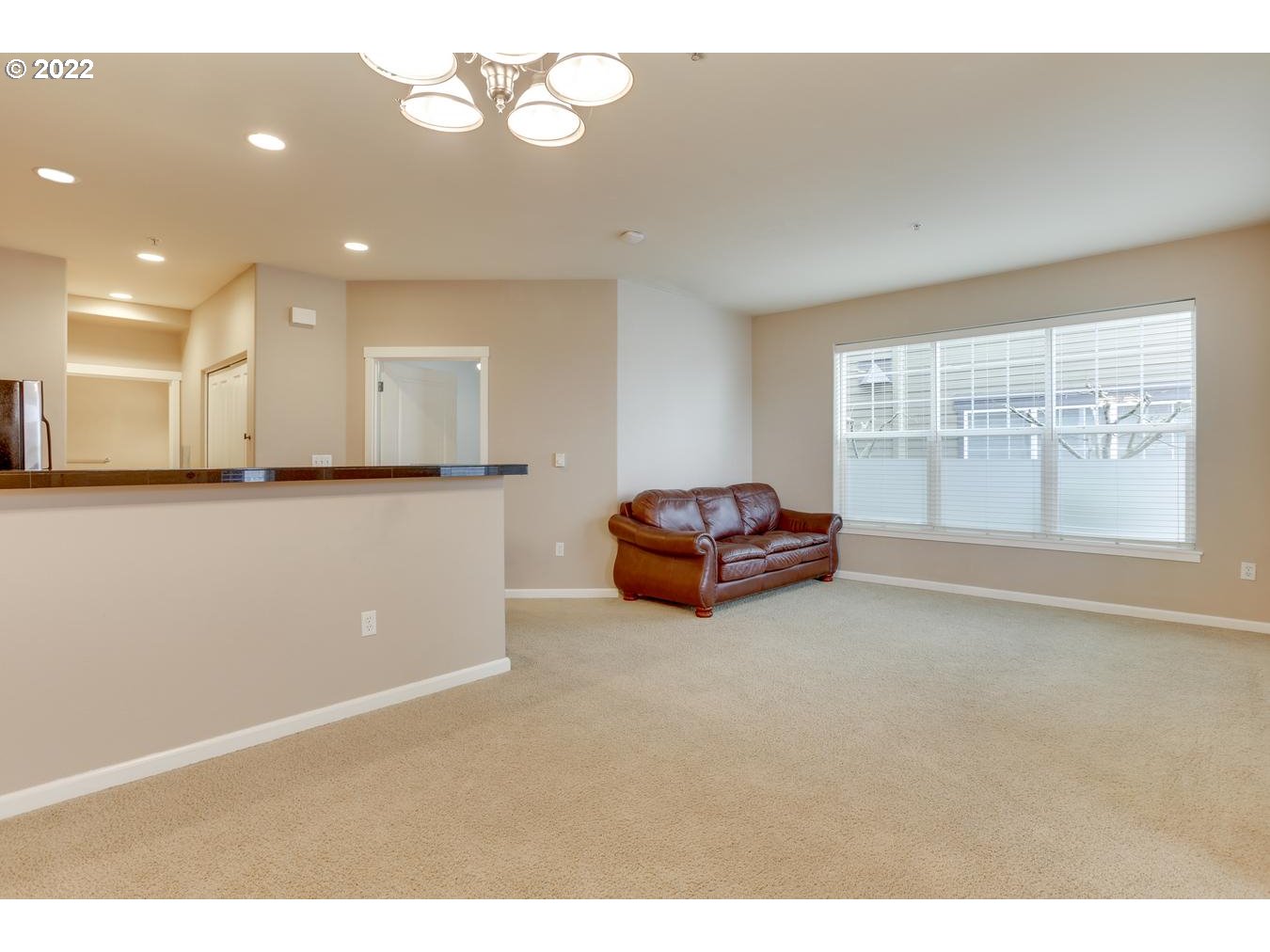 1020 Southwest 170th Avenue, Unit 100 Beaverton, OR 97003 - Photo 7 of 28 a living room with furniture and a large window