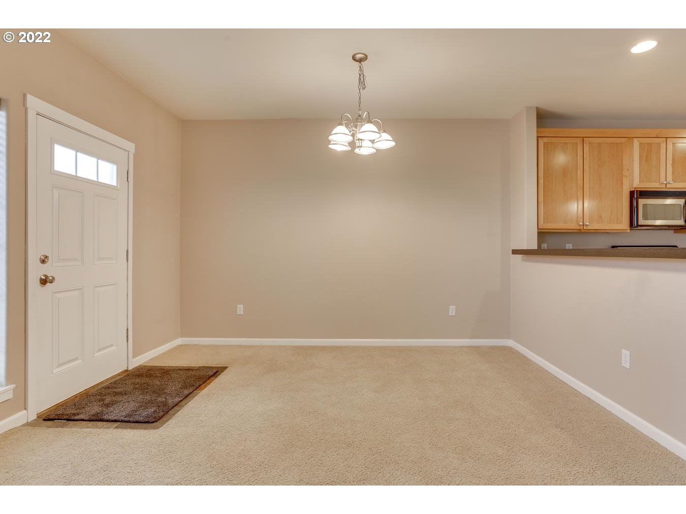 1020 Southwest 170th Avenue, Unit 100 Beaverton, OR 97003 - Photo 10 of 28 a view of a kitchen with wooden floor and a kitchen