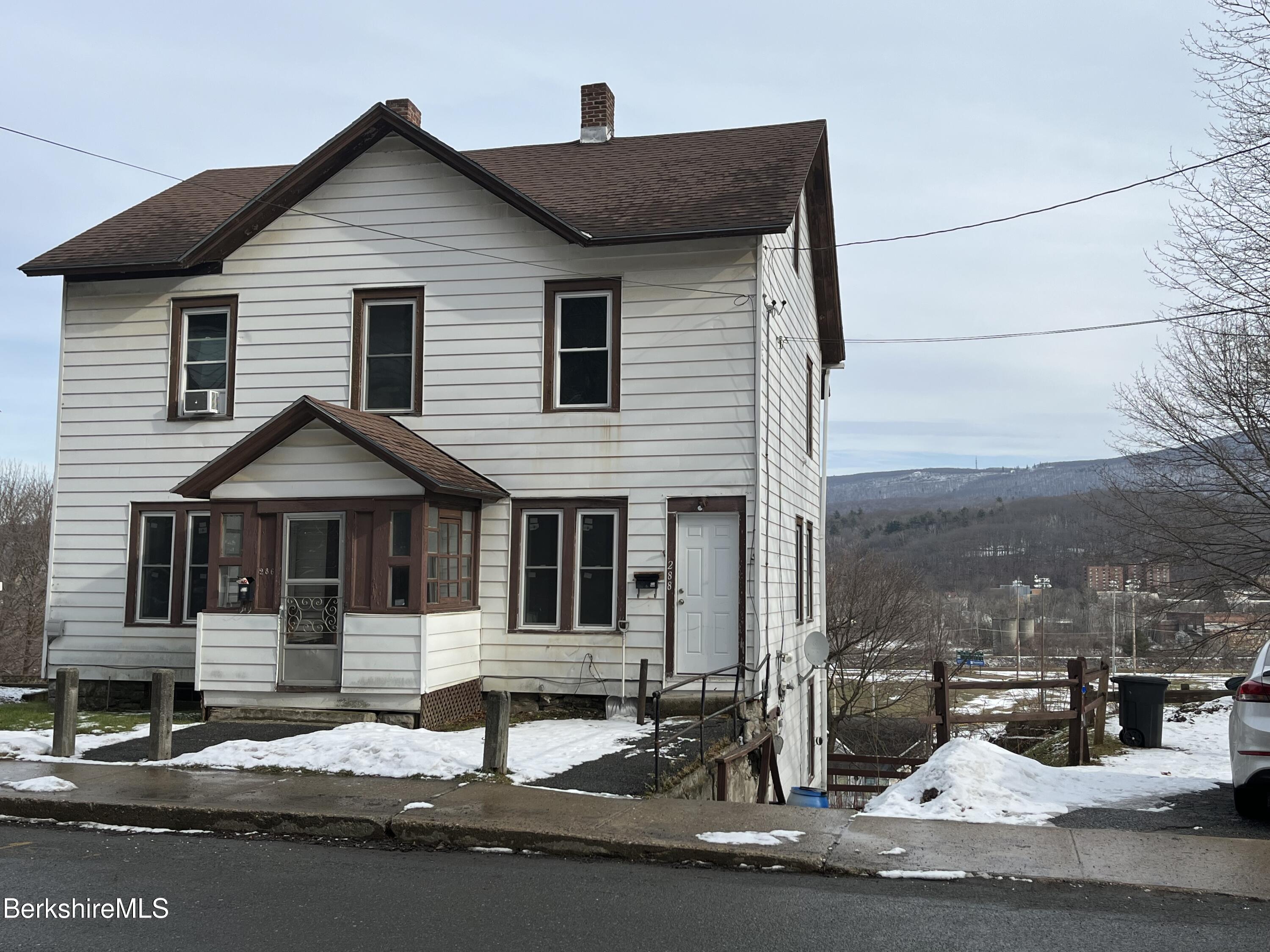 a front view of a house with yard