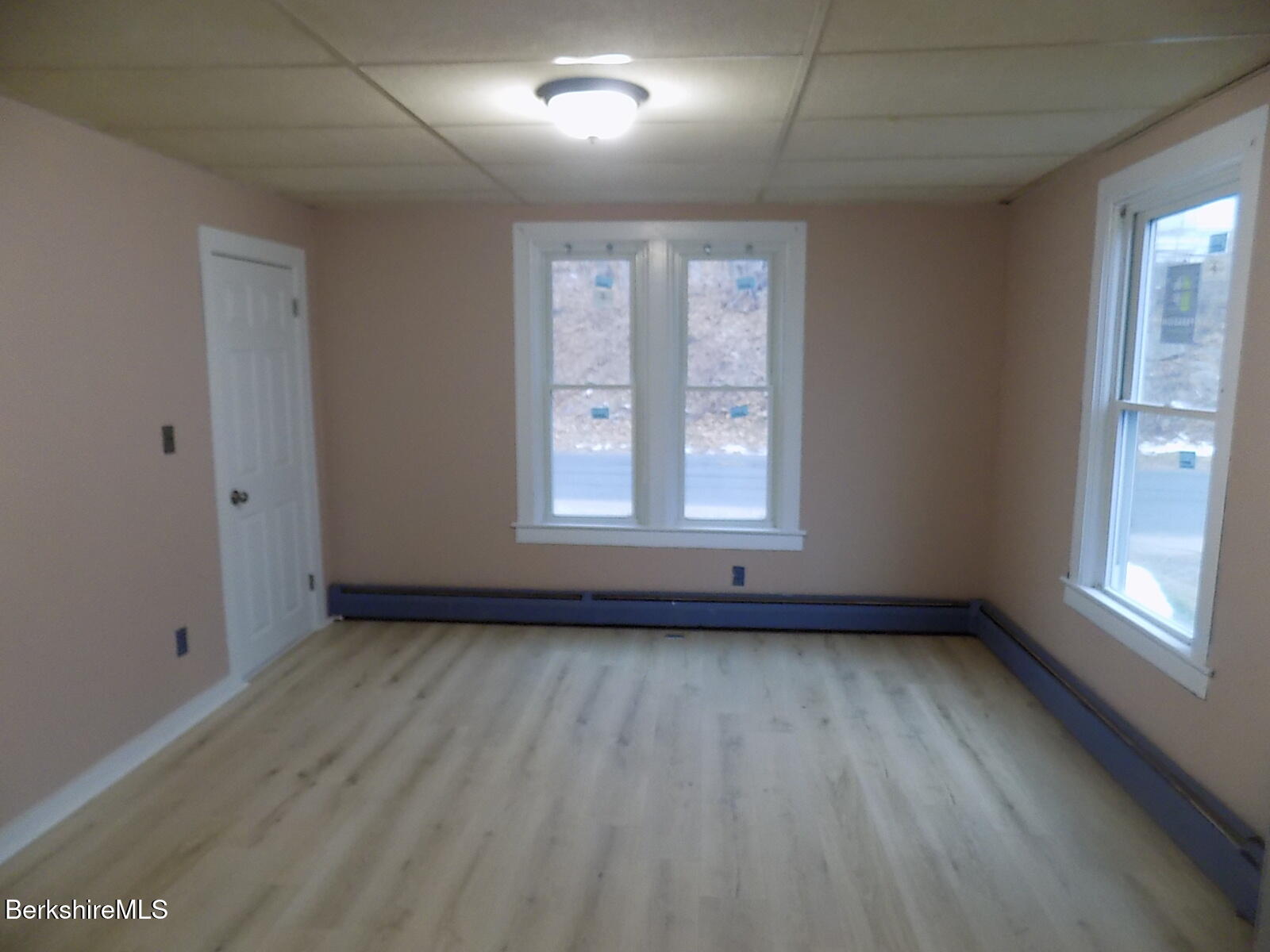 286 Walnut Street North Adams, MA 01247 - Photo 11 of 24 an empty room with wooden floor and windows