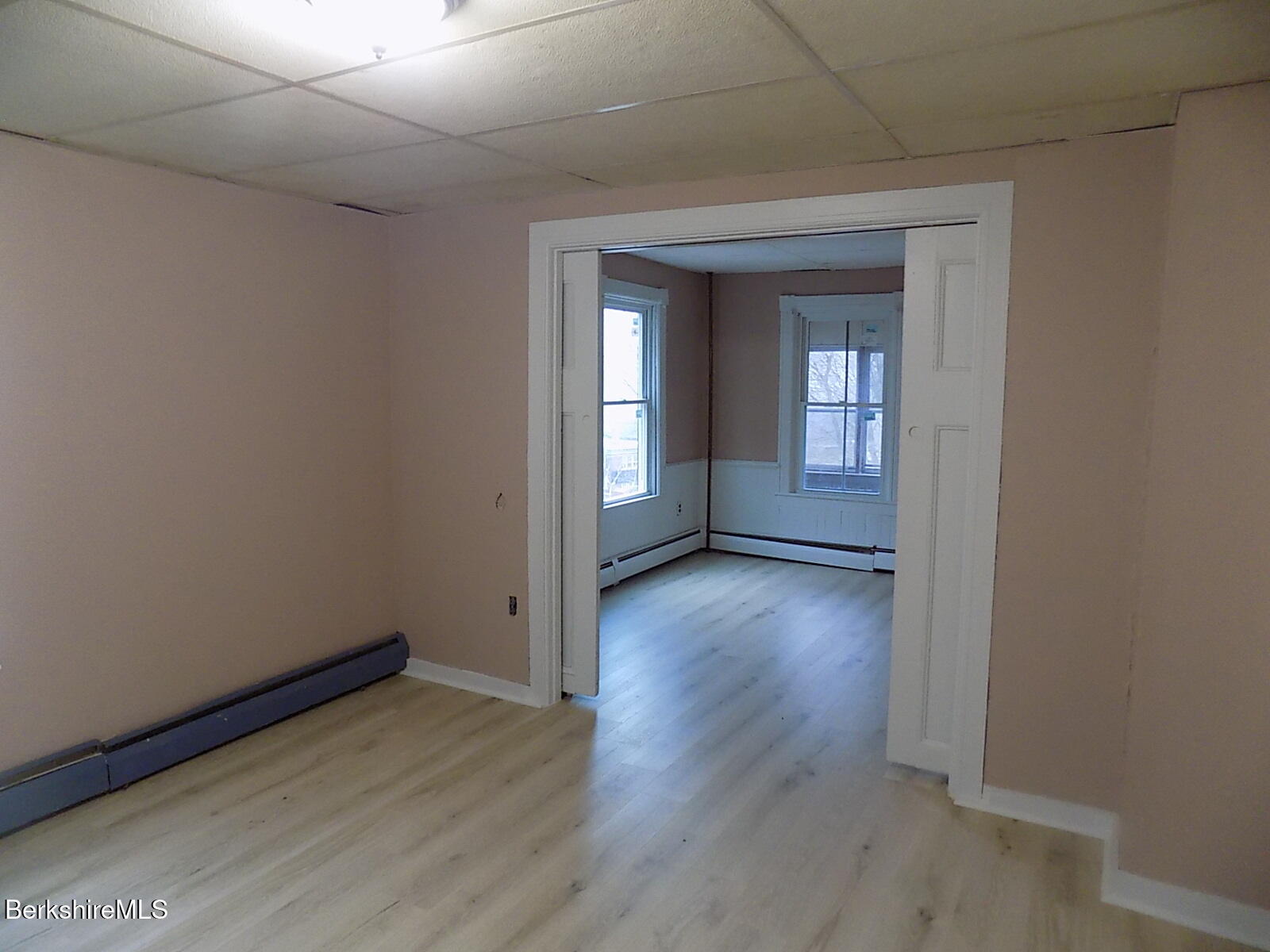 286 Walnut Street North Adams, MA 01247 - Photo 12 of 24 an empty room with wooden floor and windows