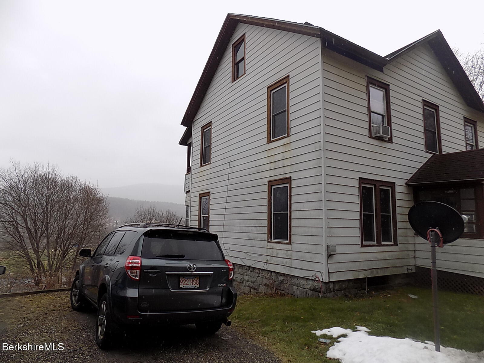 286 Walnut Street North Adams, MA 01247 - Photo 4 of 24 a front view of a house with a garden