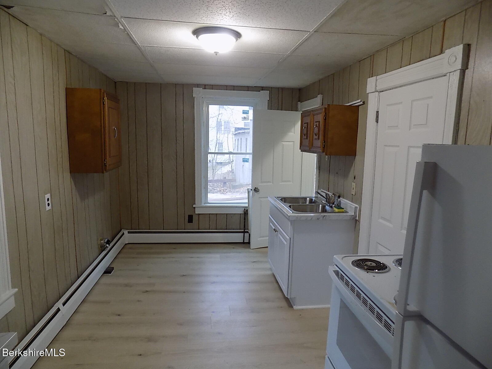 286 Walnut Street North Adams, MA 01247 - Photo 6 of 24 a kitchen with a refrigerator and a stove