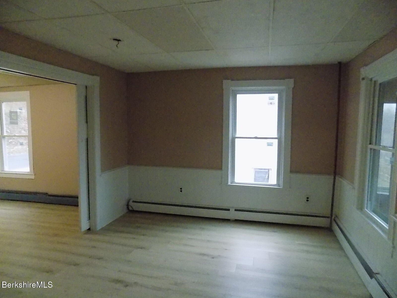 286 Walnut Street North Adams, MA 01247 - Photo 7 of 24 an empty room with wooden floor and windows