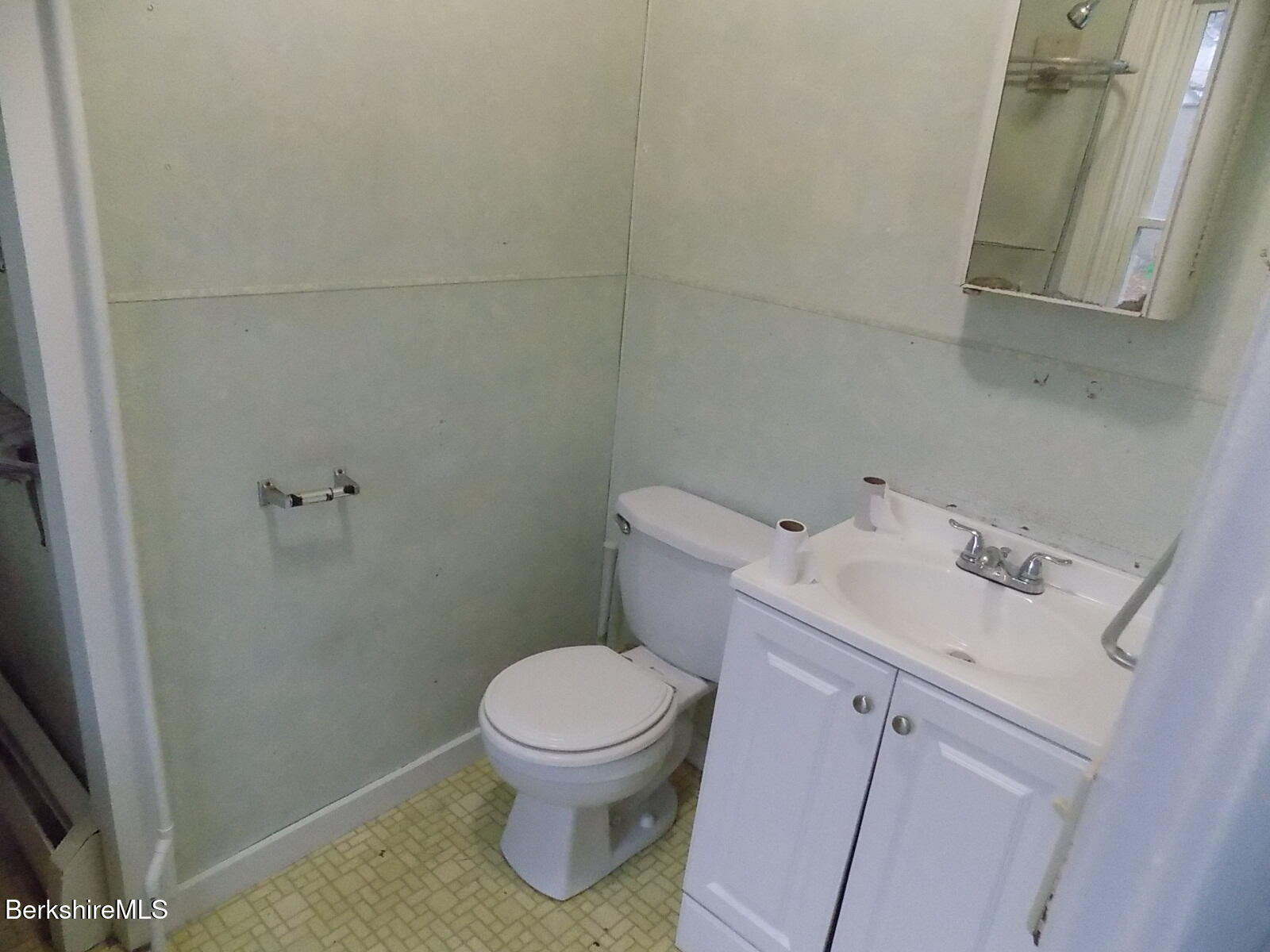 286 Walnut Street North Adams, MA 01247 - Photo 9 of 24 a white toilet sitting next to a bathroom sink