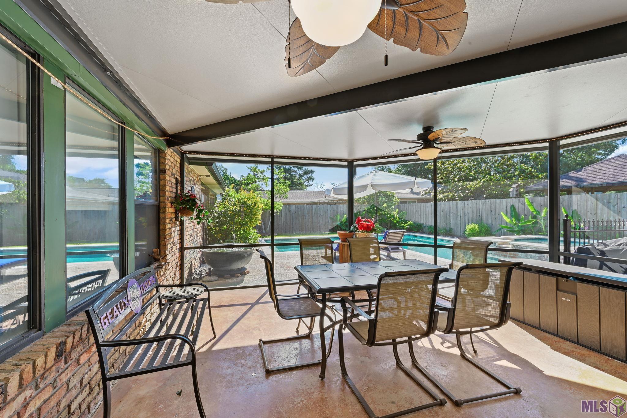 9979 Hackberry Drive Baton Rouge, LA 70809 - Photo 23 of 27 Huge screened in porch with ceiling fans