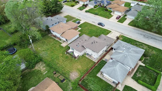 an aerial view of a house with a garden