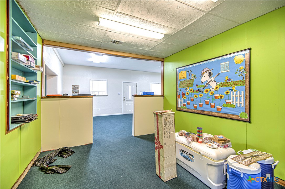 13875 Moffat Road Temple, TX 76502 - Photo 29 of 39 a room with furniture and screen gym equipment
