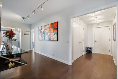 a view of a livingroom with furniture and hardwood floor