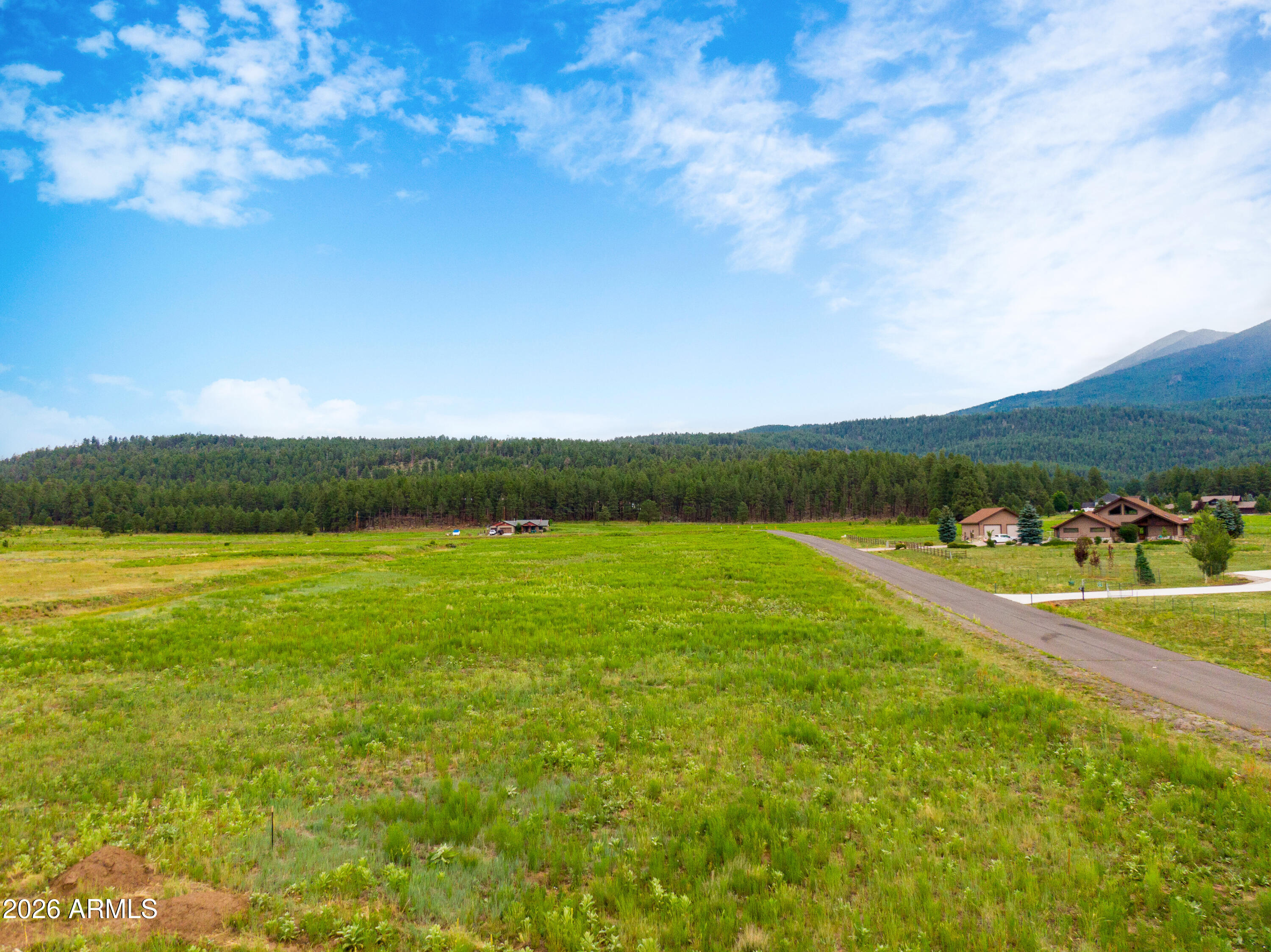 8914 Ranch At The Peaks Way, Unit 16 Flagstaff, AZ 86001 - Photo 14 of 25 a view of a field with an ocean