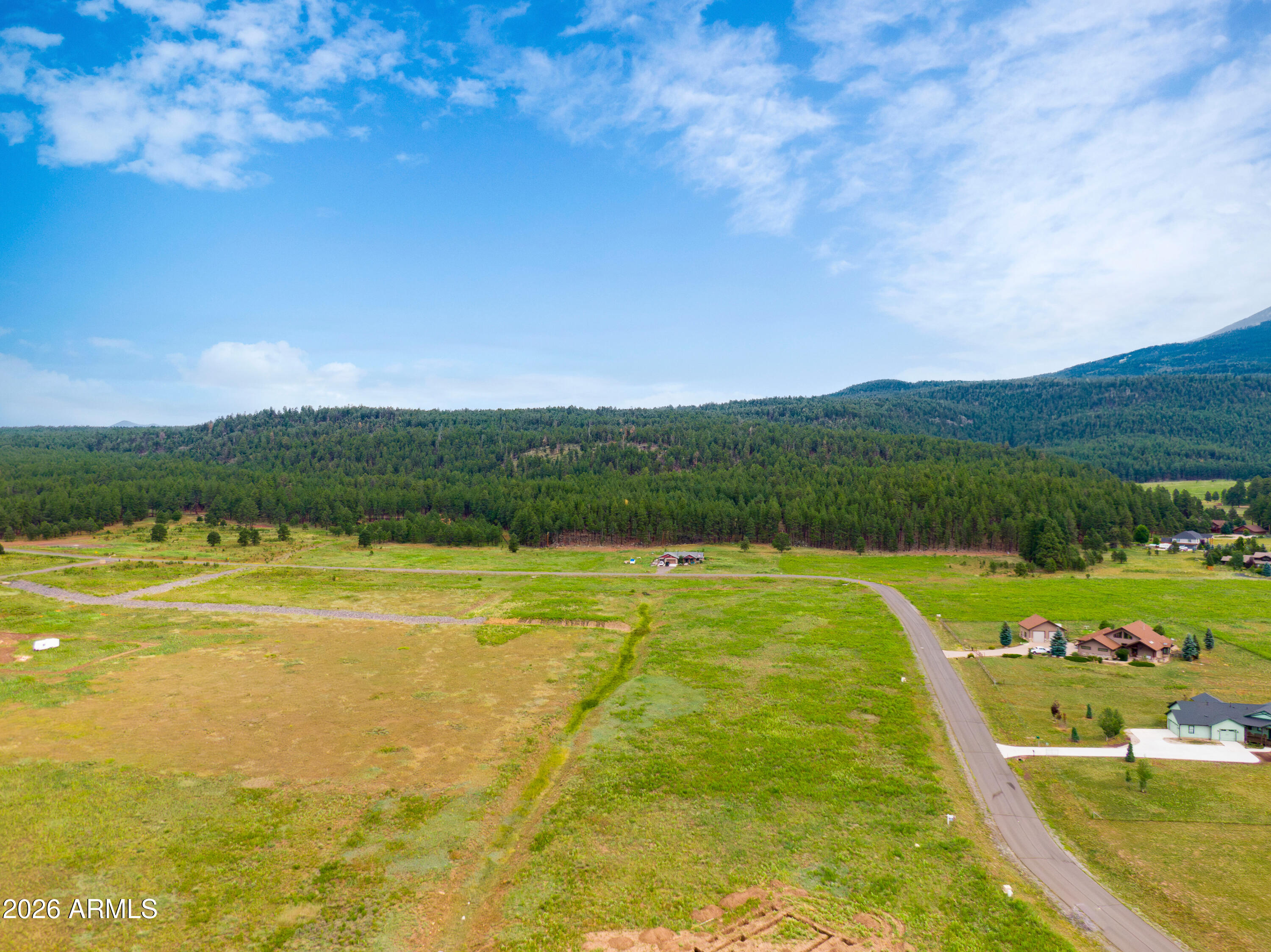8914 Ranch At The Peaks Way, Unit 16 Flagstaff, AZ 86001 - Photo 15 of 25 a view of a swimming pool and a yard