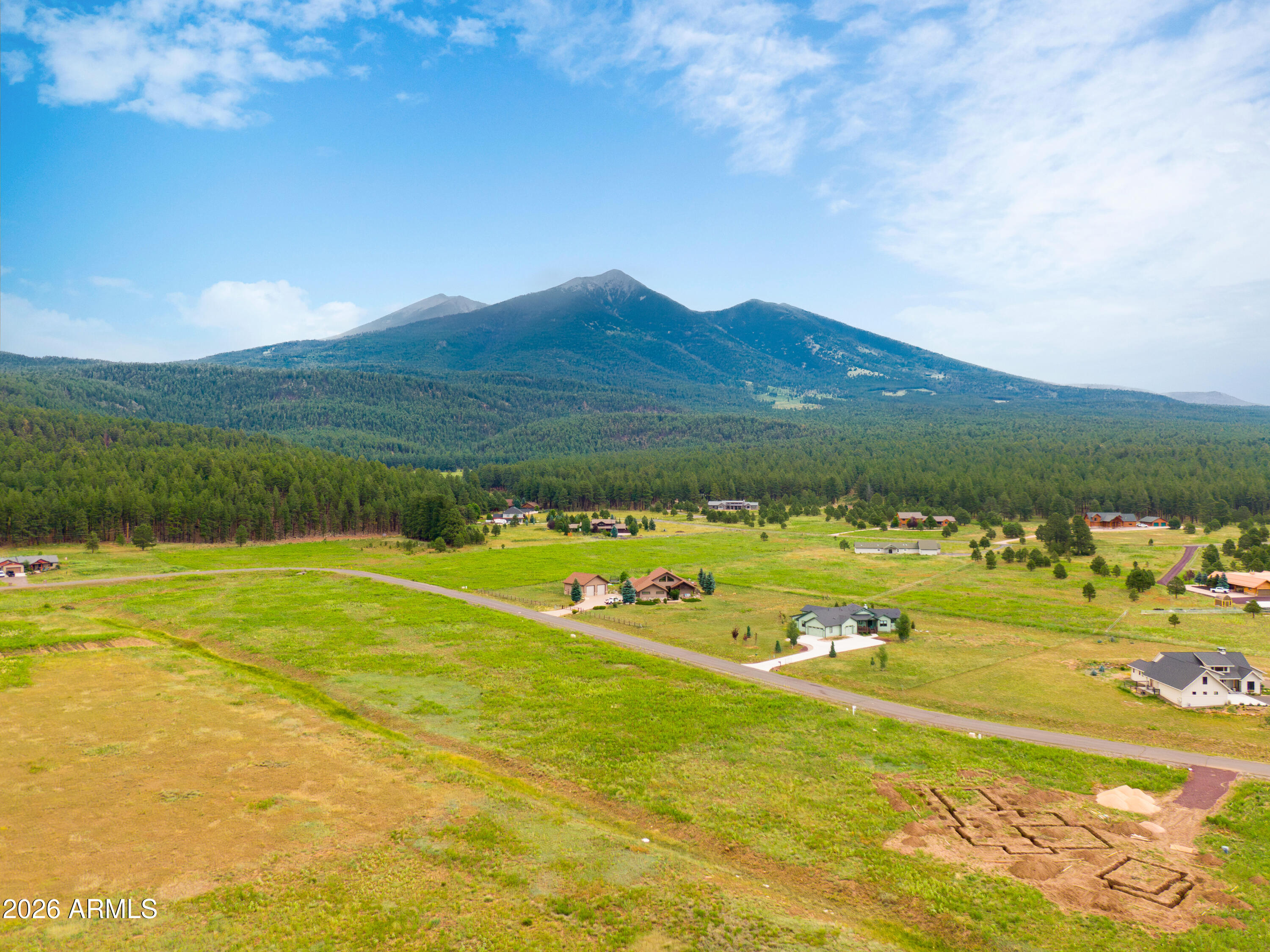 8914 Ranch At The Peaks Way, Unit 16 Flagstaff, AZ 86001 - Photo 25 of 25 a view of a lake with a mountain in the background