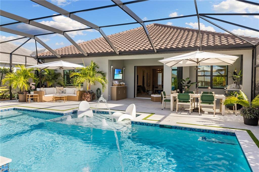 3967 Pegasus Way Naples, FL 34120 - Photo 24 of 50 a view of a swimming pool with a patio