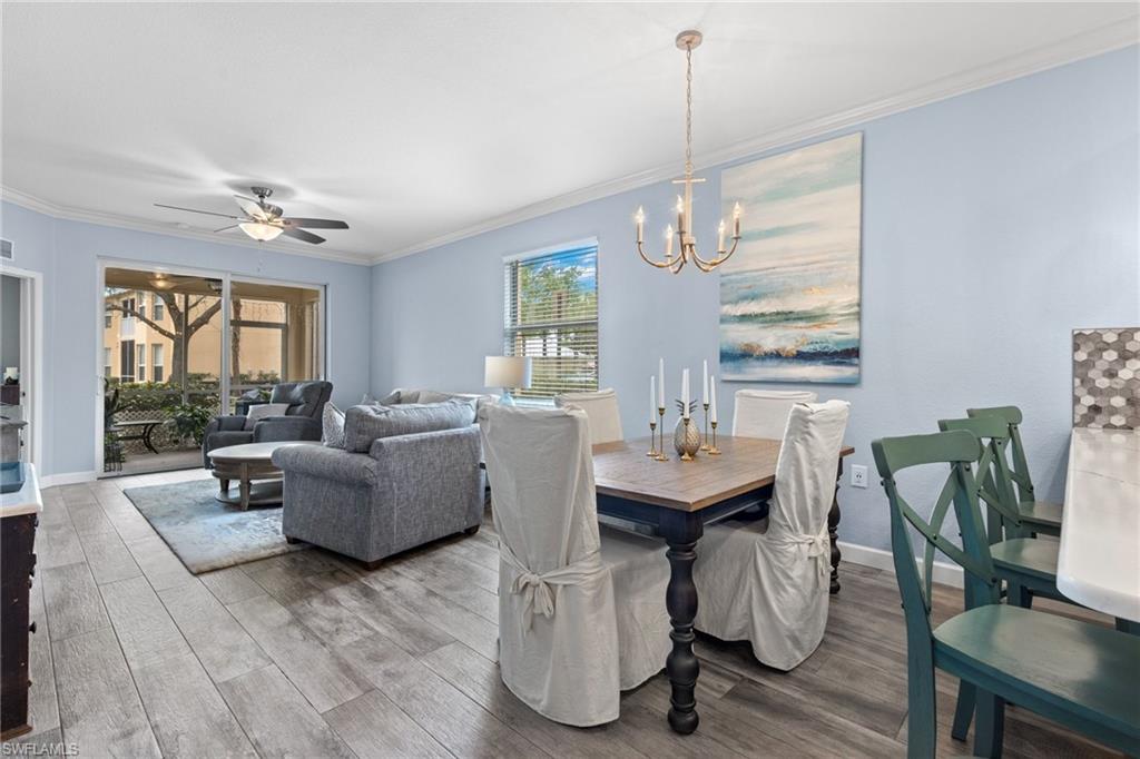 8550 Kingbird Loop, Unit 620 Estero, FL 33967 - Photo 12 of 30 a living room with fireplace furniture and a large window