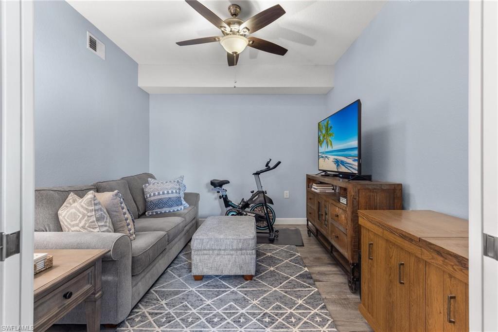 8550 Kingbird Loop, Unit 620 Estero, FL 33967 - Photo 22 of 30 a living room with furniture and a flat screen tv