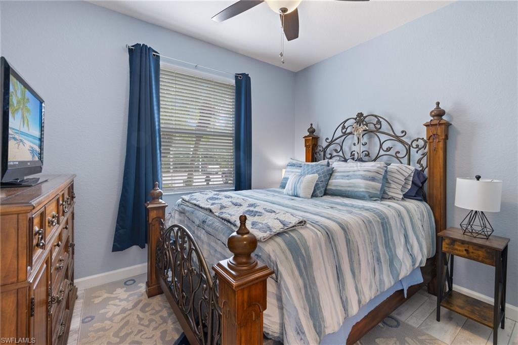 8550 Kingbird Loop, Unit 620 Estero, FL 33967 - Photo 23 of 30 a bedroom with a bed and a tv