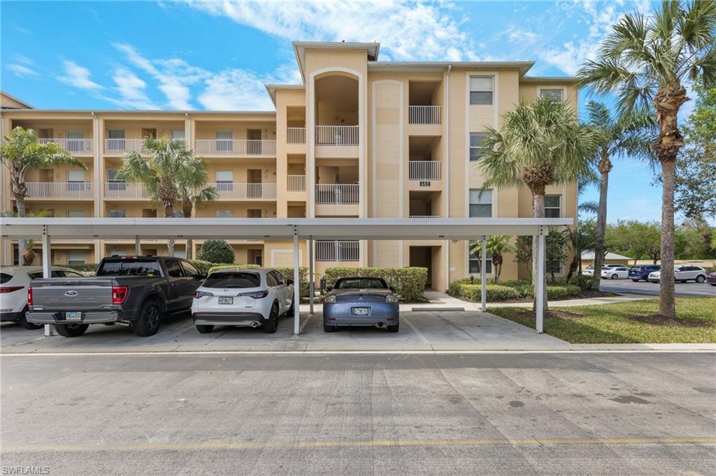 8550 Kingbird Loop, Unit 620 Estero, FL 33967 - Photo 26 of 30 a car parked in front of a building