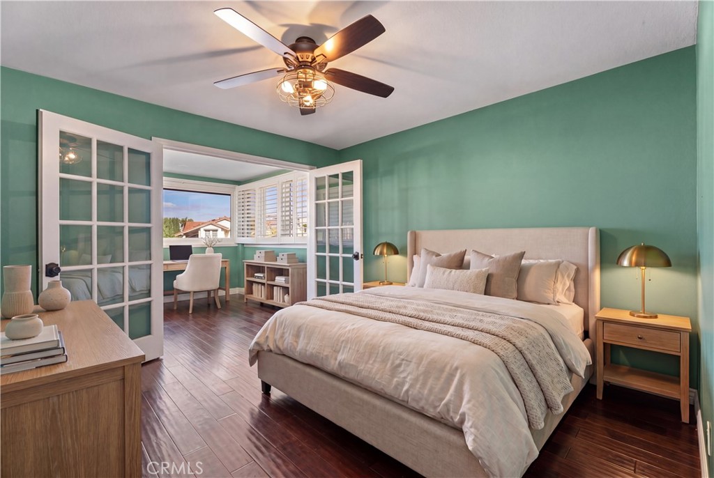 21732 Exton Way Lake Forest, CA 92630 - Photo 17 of 29 Top floor bedroom with bonus office space. Ceiling fan and french doors. Virtually staged, find originals at https://bit.ly/3OvKmPn