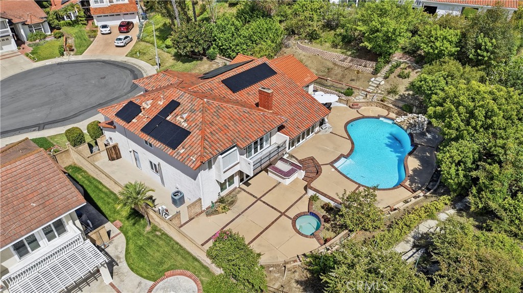 21732 Exton Way Lake Forest, CA 92630 - Photo 4 of 29 Aerial view of in-ground pool and spa. Mature fruit trees and garden paths. Dual side yards. Cars and personal objects digitally removed. original photos https://bit.ly/3OvKmPn