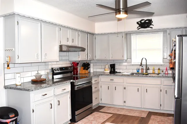 a front view of a house with a lake view