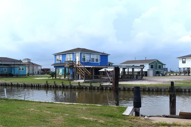 a view of a city with tall buildings and a yard in front of it