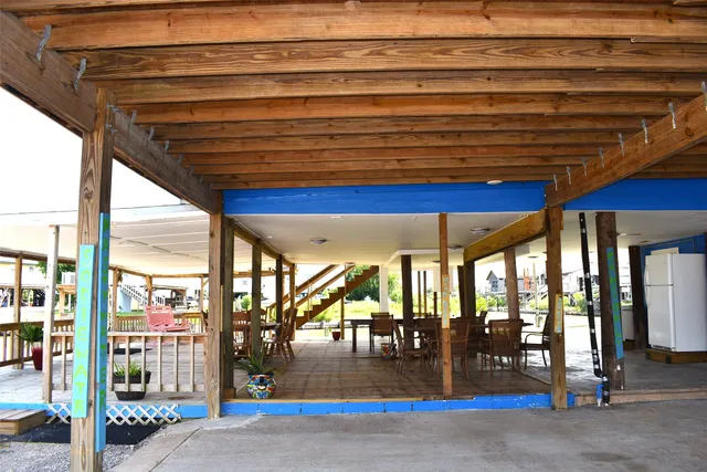 a view of a room with wooden floors