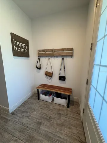 a view of outdoor space with wooden floor